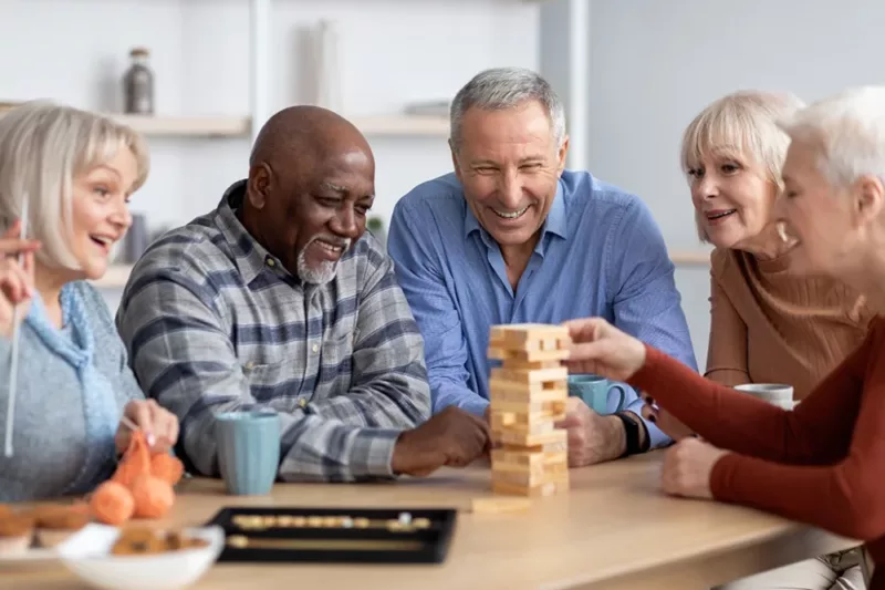 Residents enjoying a game of Jenga together.
