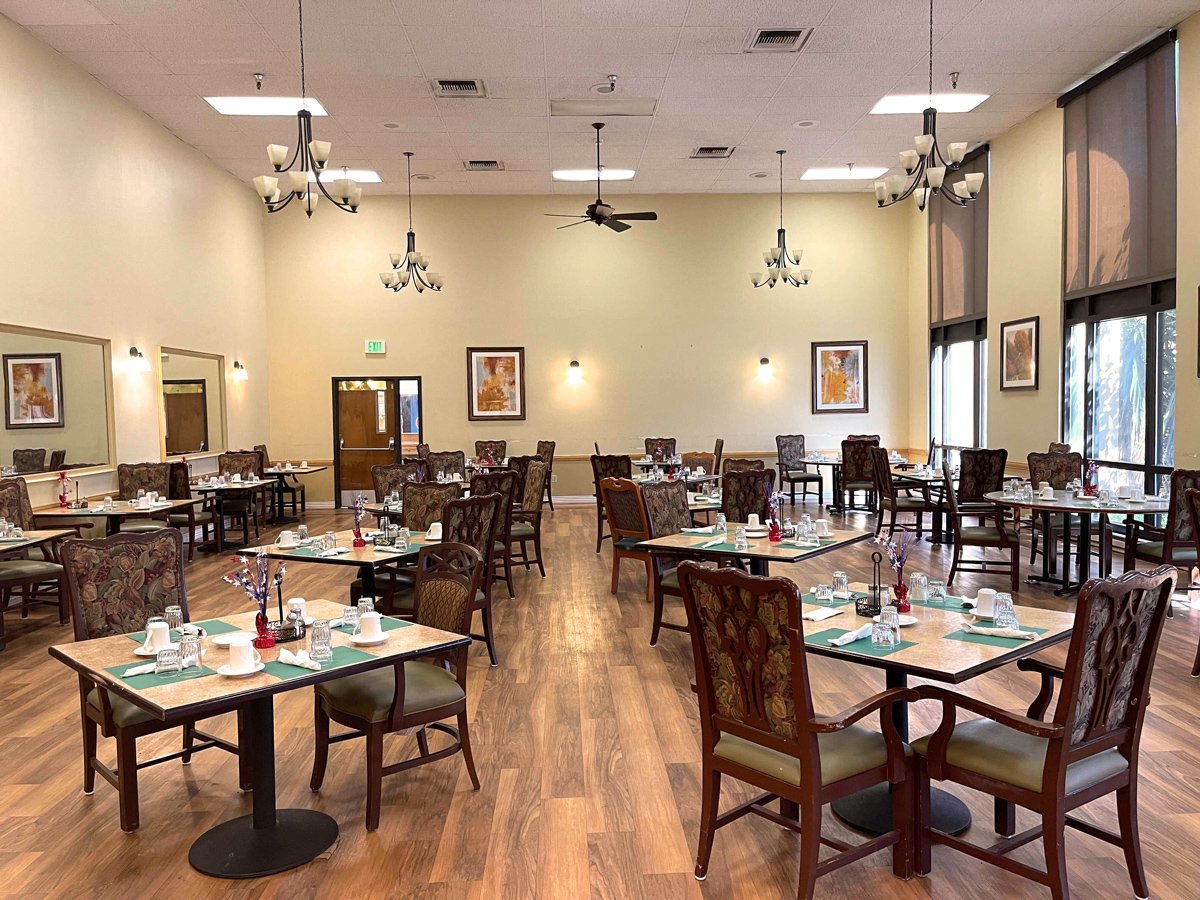 Dining room with tables set for meals.