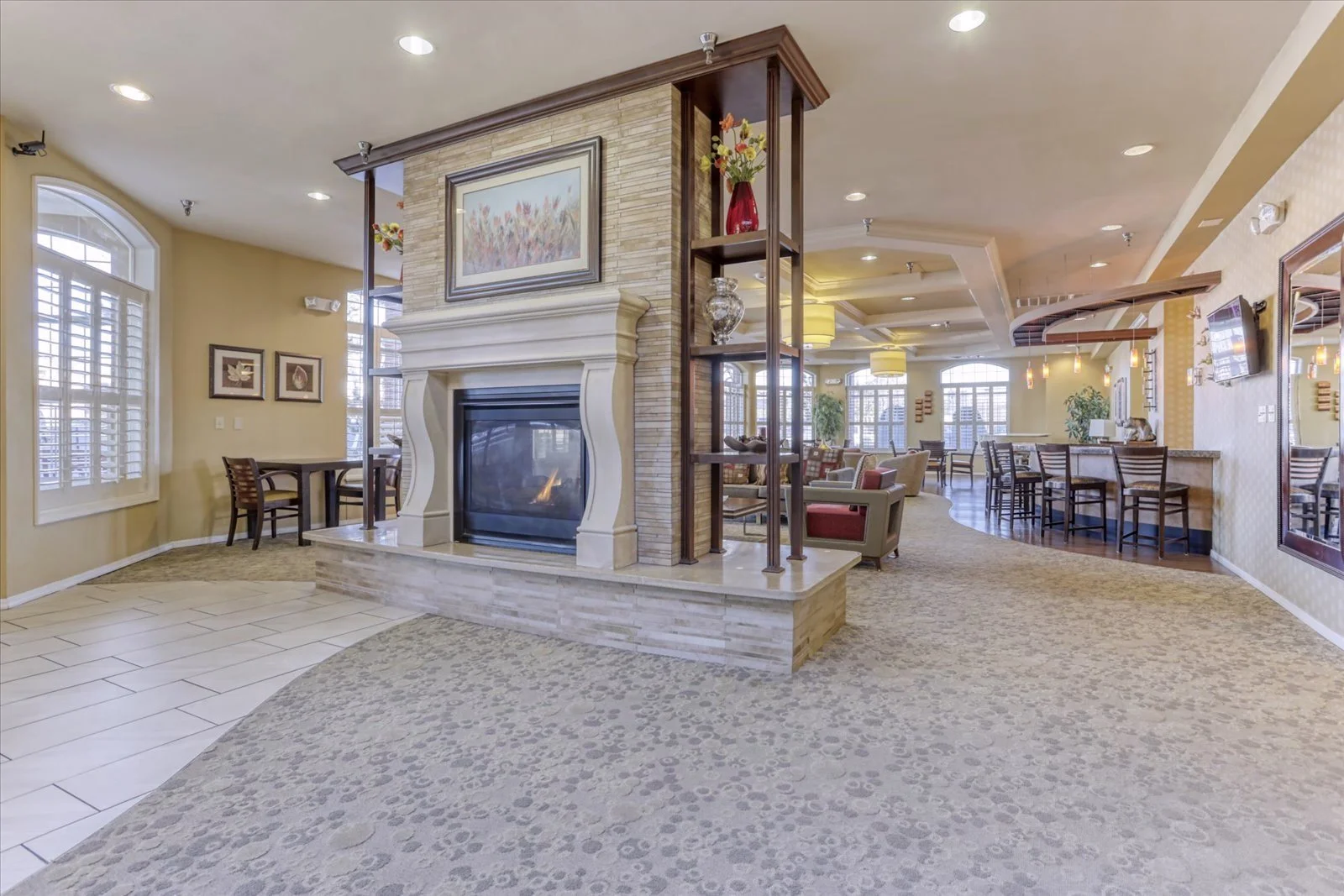 Interior common area with seating and a fireplace