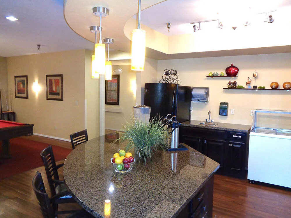 Interior kitchen and dining area with bar seating