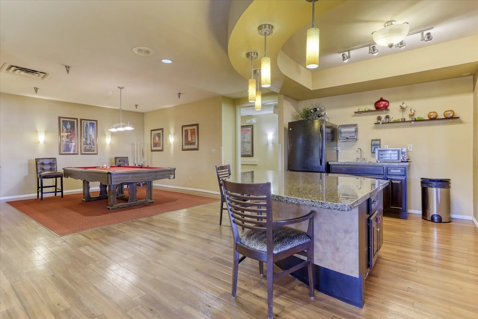 Common area with pool table and kitchenette