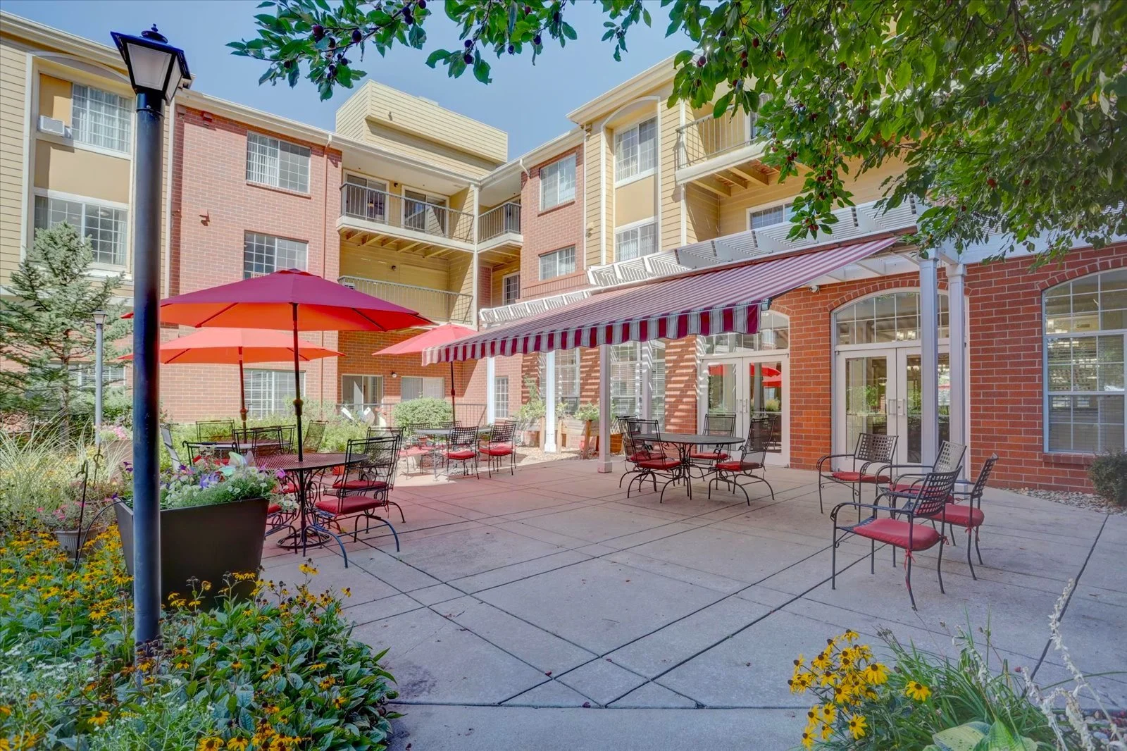 Beautiful outdoor patio area with seating and umbrellas.
