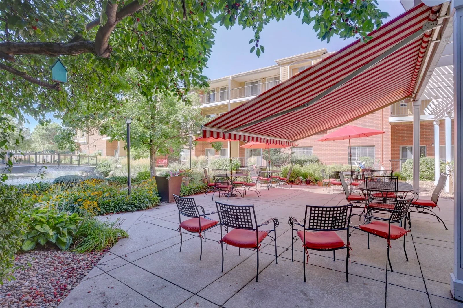 Outdoor seating area with tables and plants