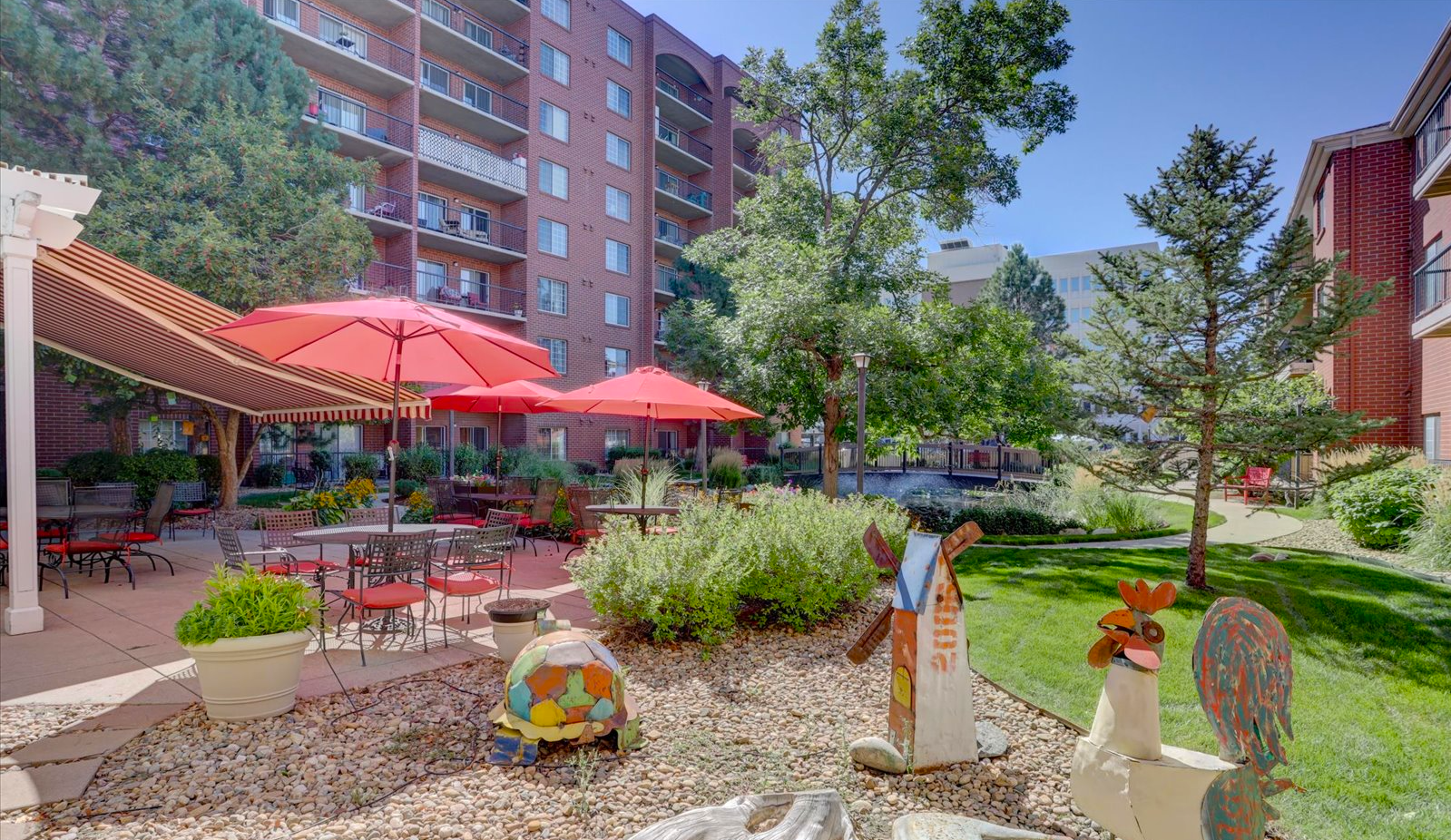 Outdoor garden area with seating and decorative sculptures