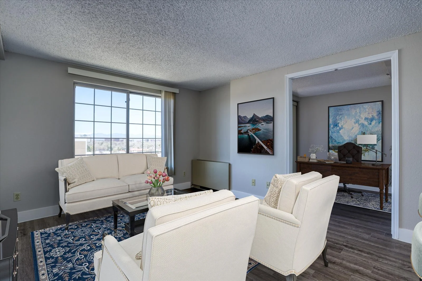 Bright and welcoming common area with seating and art.