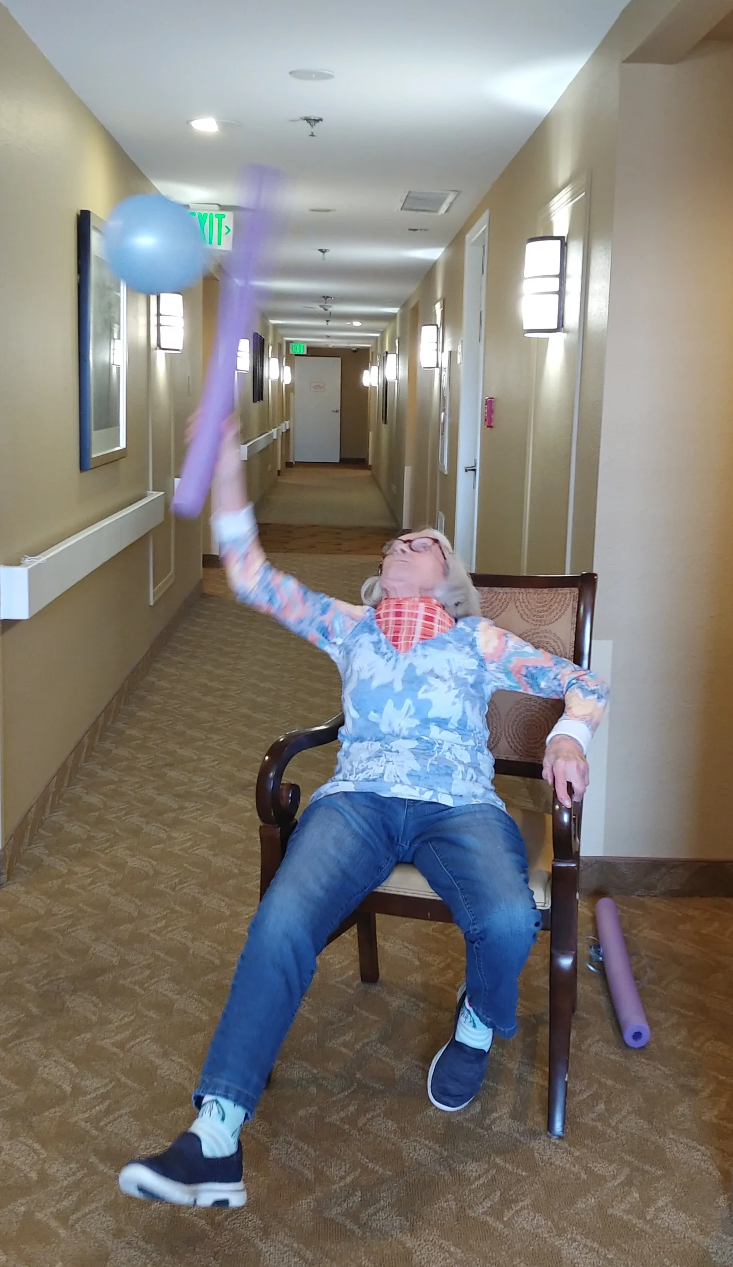 Resident engaging in an activity in the hallway