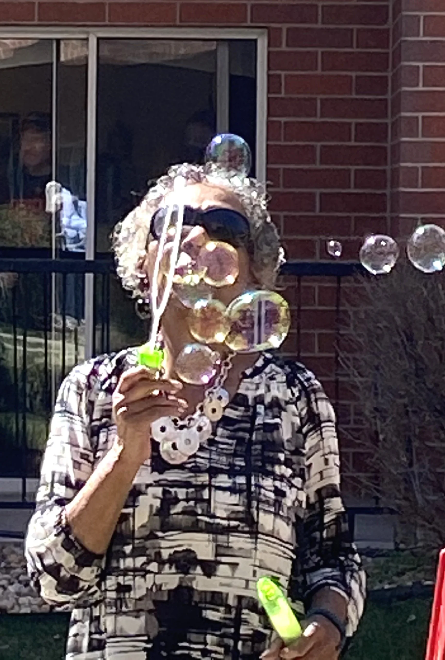 Resident enjoying bubbles outdoors