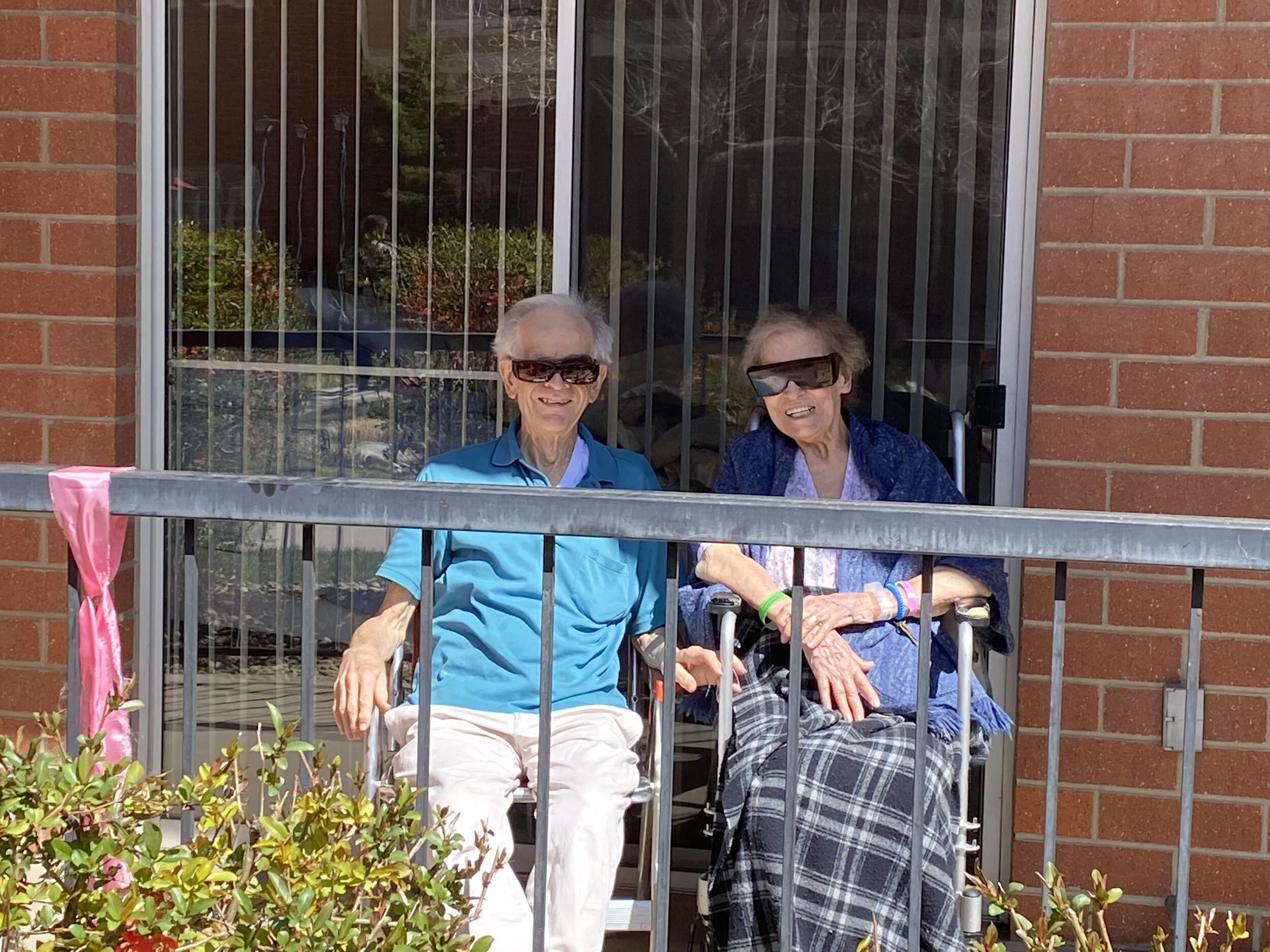 Two residents enjoying the outdoors on a sunny day.