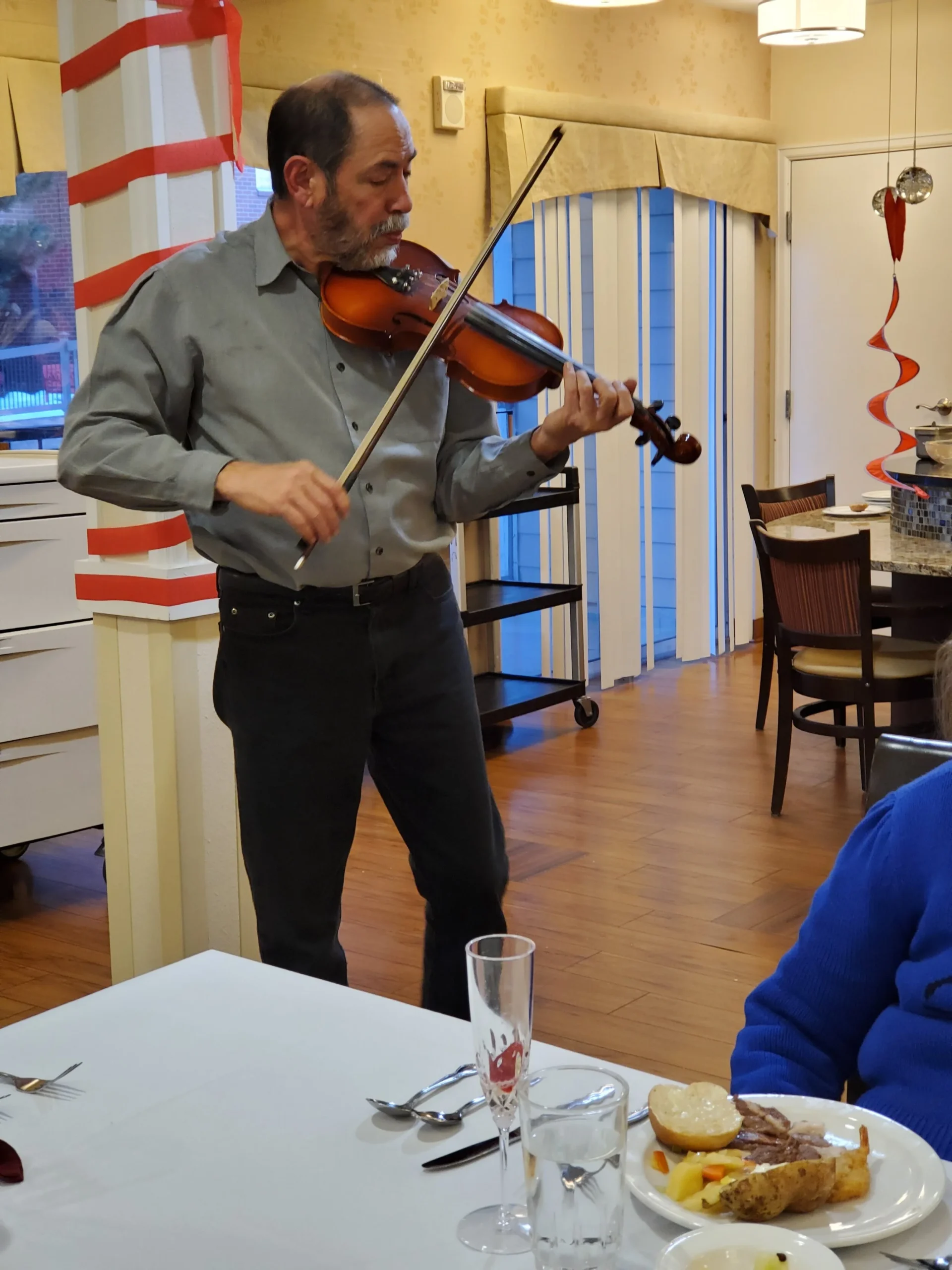 Violinist performing at a social gathering