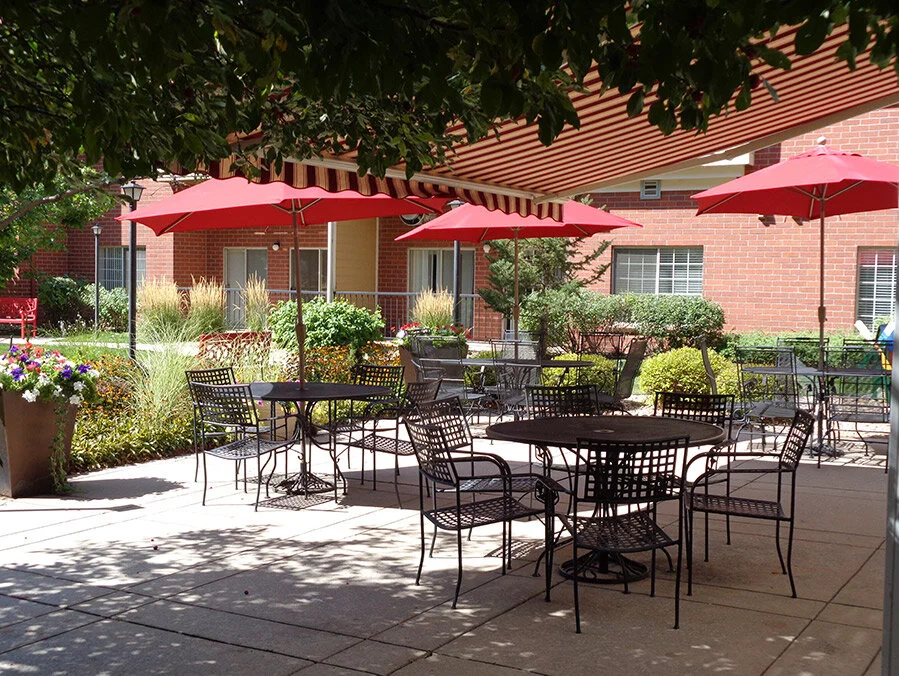 Outdoor seating area with umbrellas and plants