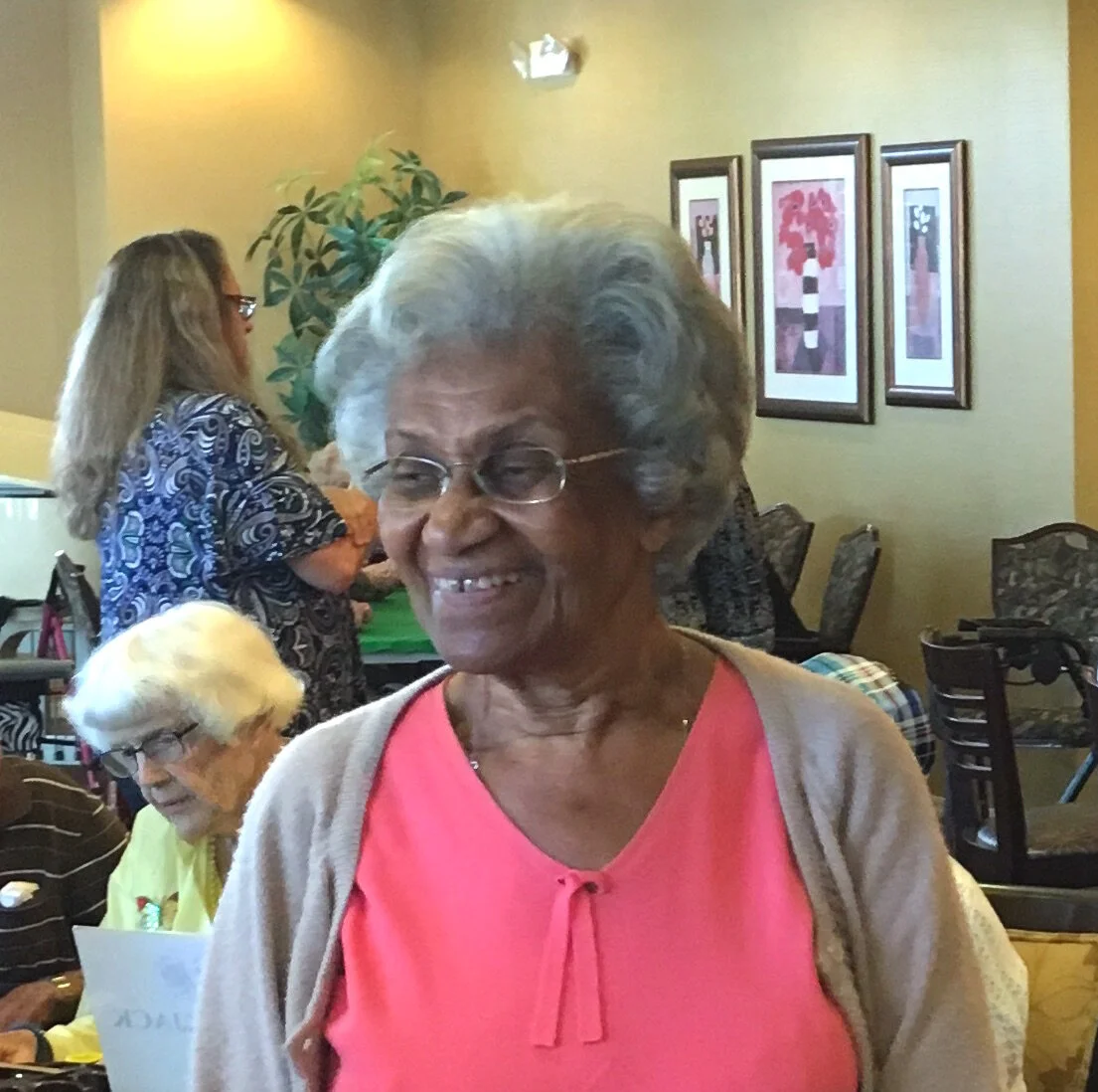 Residents engaging in a social gathering indoors.