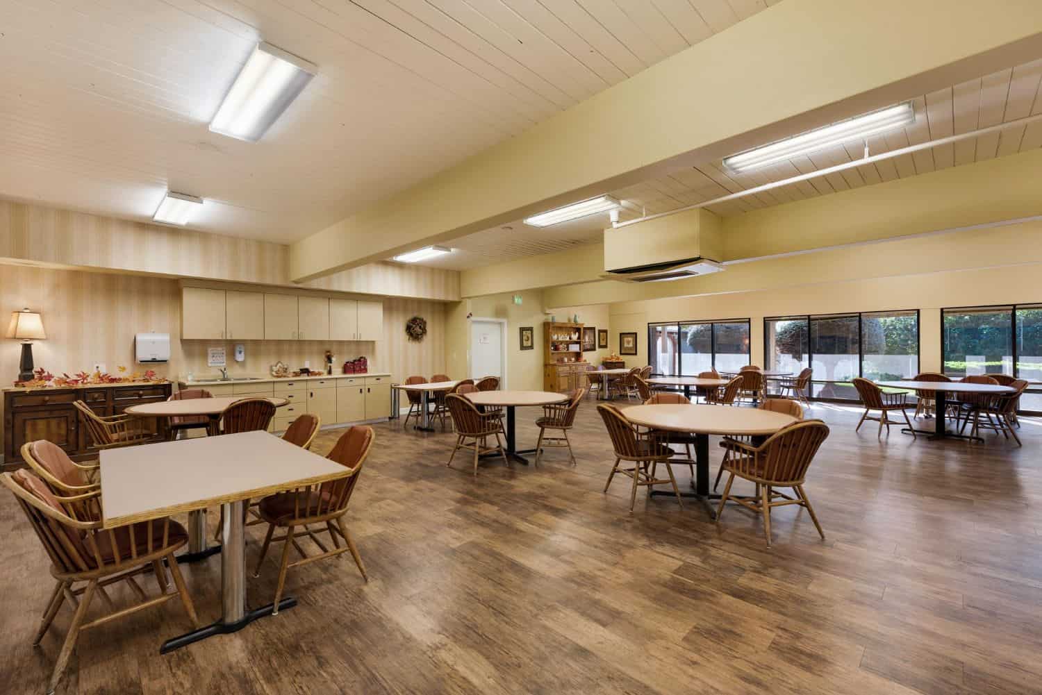 Bright, spacious dining area with tables and chairs