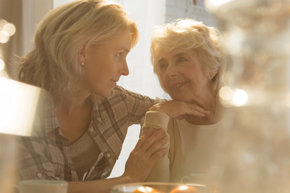 Younger woman interacting with an older woman