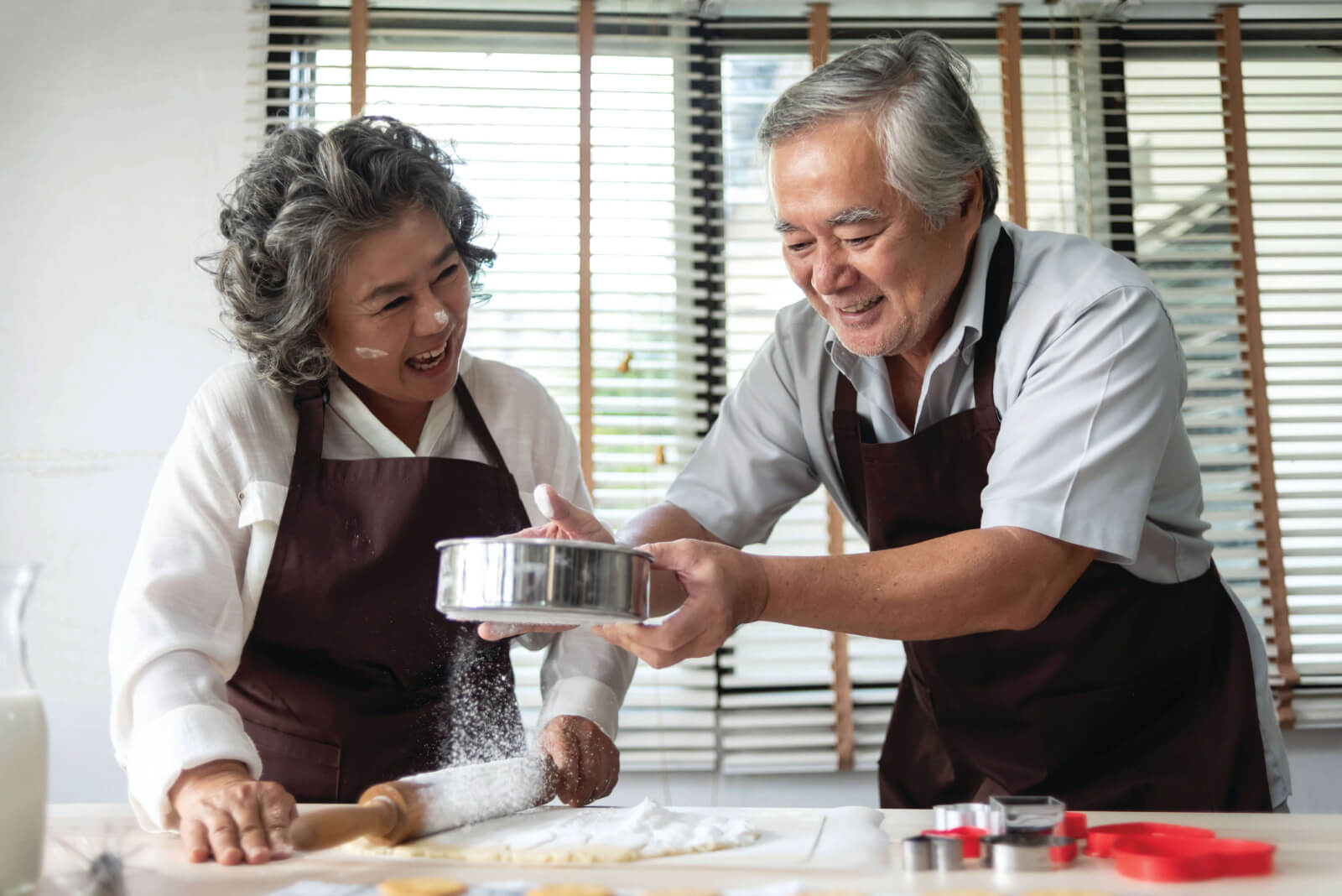 Residents engaging in a cooking activity in the facility kitchen