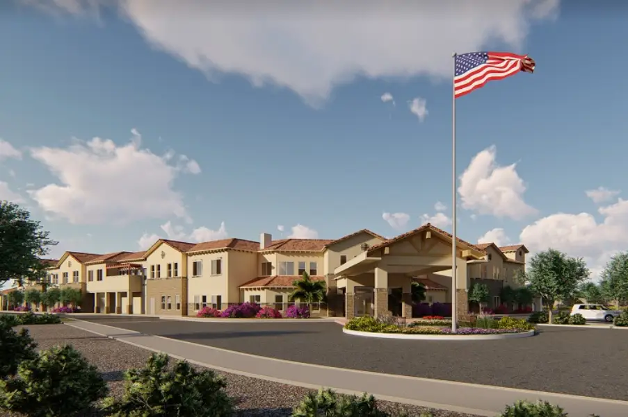 Exterior view of a senior living facility with landscaping