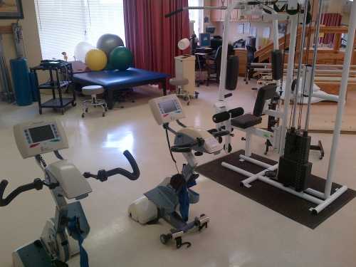 Rehabilitation gym with exercise equipment for residents