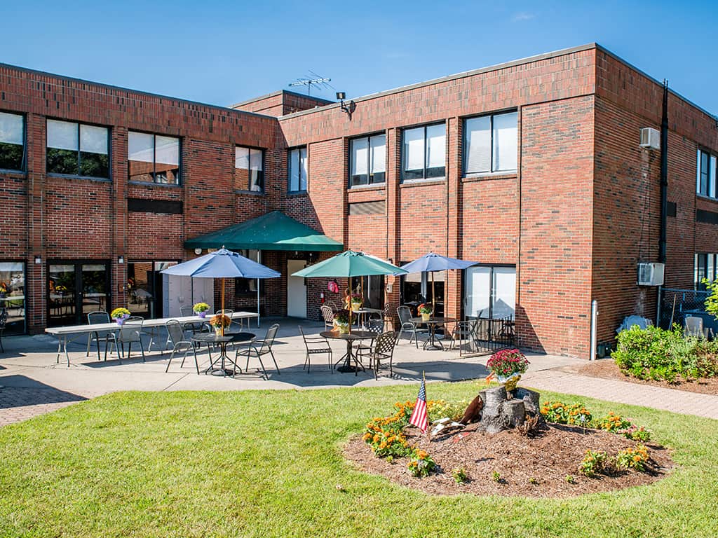 Outdoor patio area with seating and umbrellas