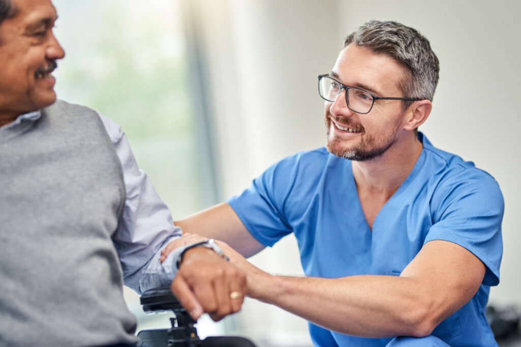 Caregiver interacting with a resident in a facility