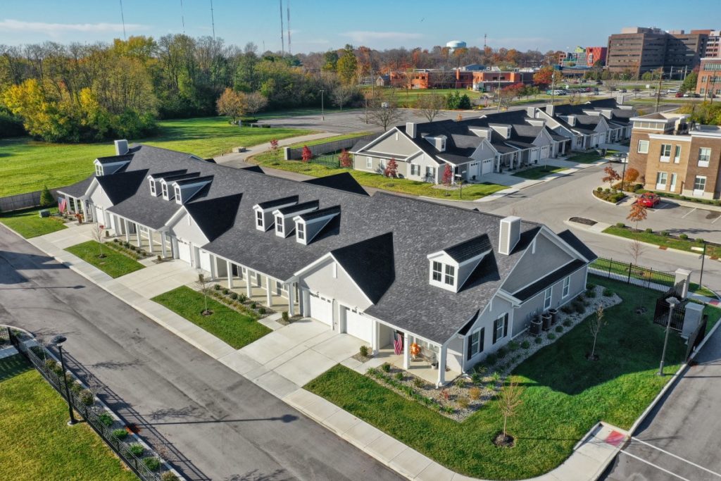 Aerial view of the senior living facility with landscaped gardens
