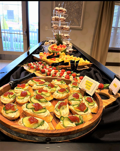 A beautifully arranged display of food featuring hors d'oeuvres.