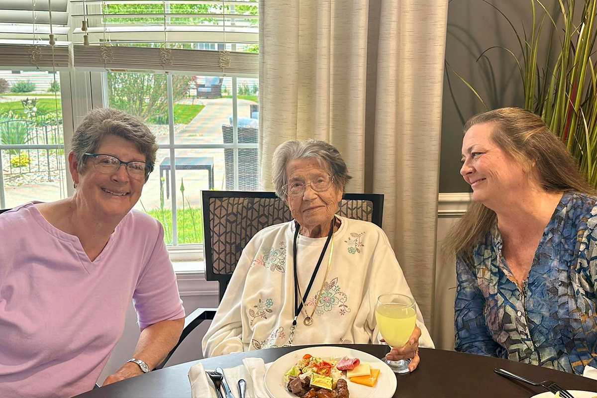 Residents enjoying a meal together in a dining area