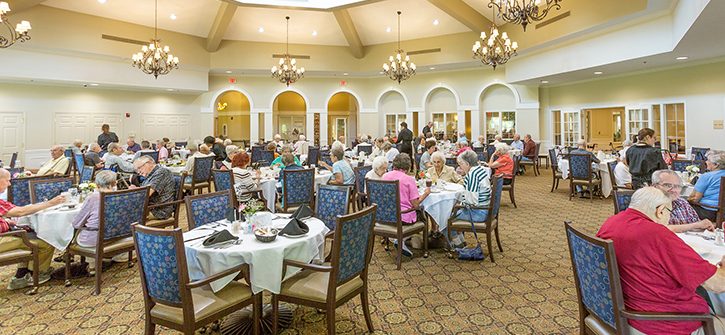 Residents enjoying a meal in the dining room
