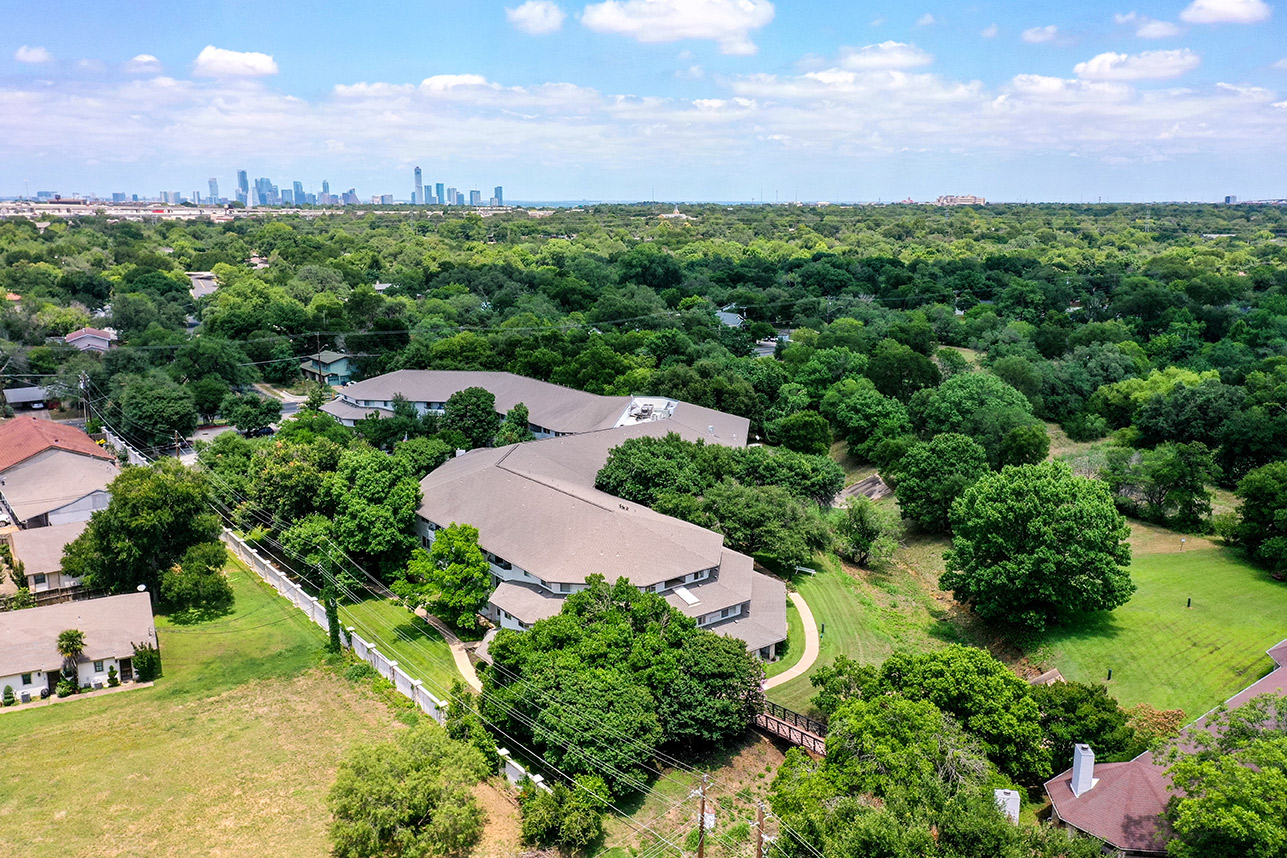 Aerial view of the senior living campus surrounded by greenery