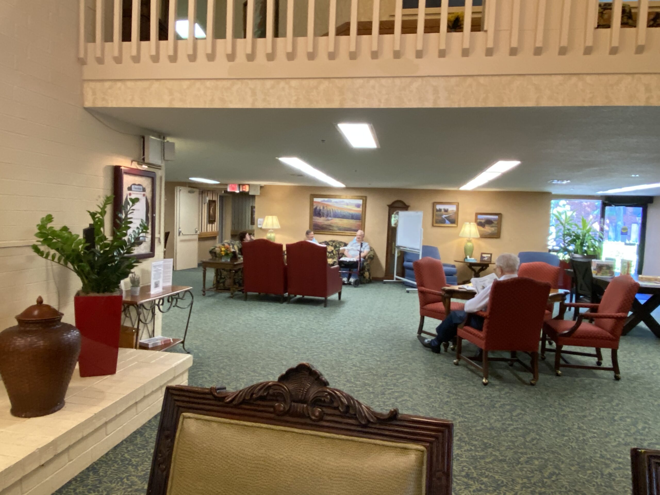 Residents relaxing in a common area with seating