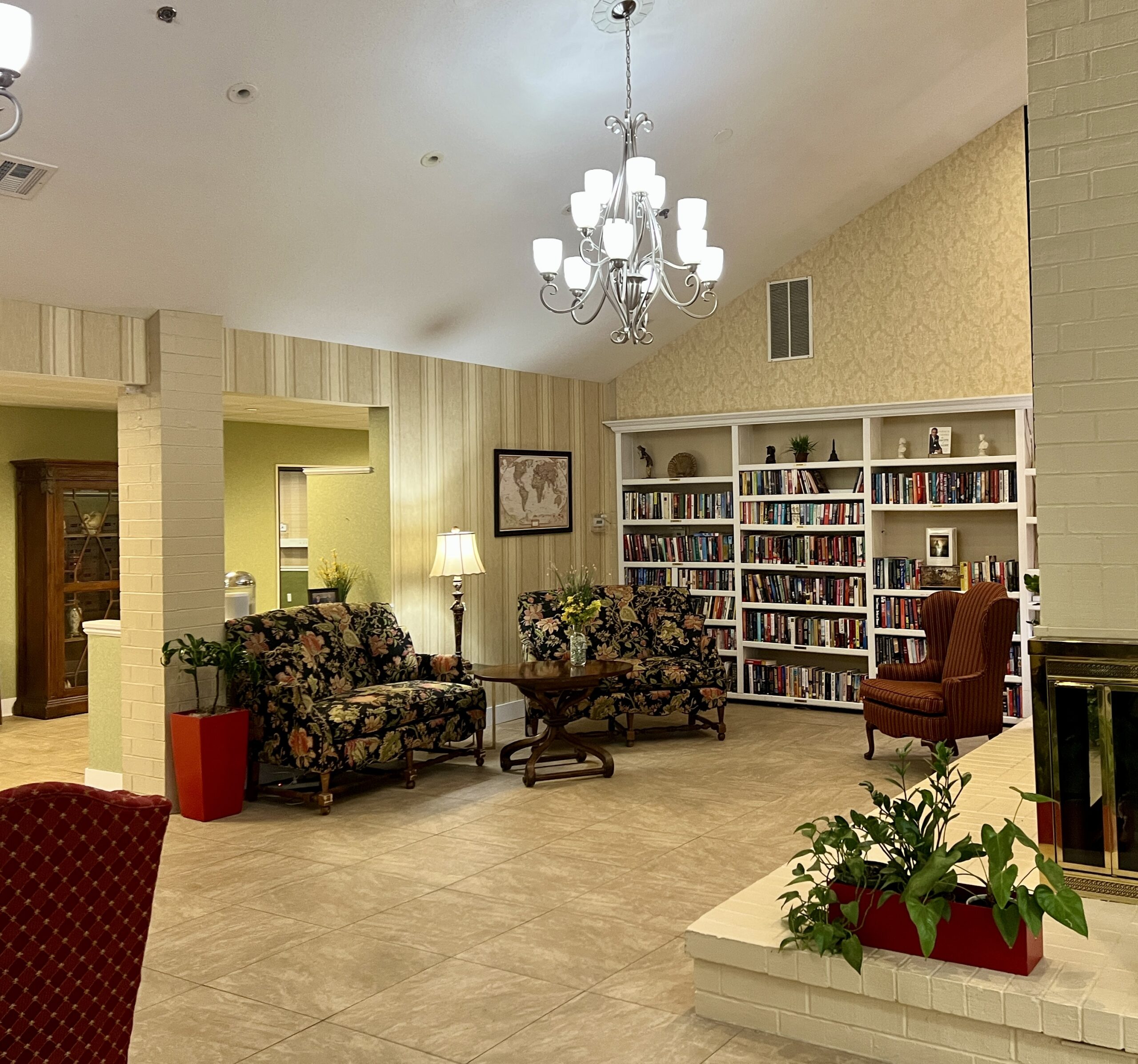 Cozy common area with bookshelves and seating