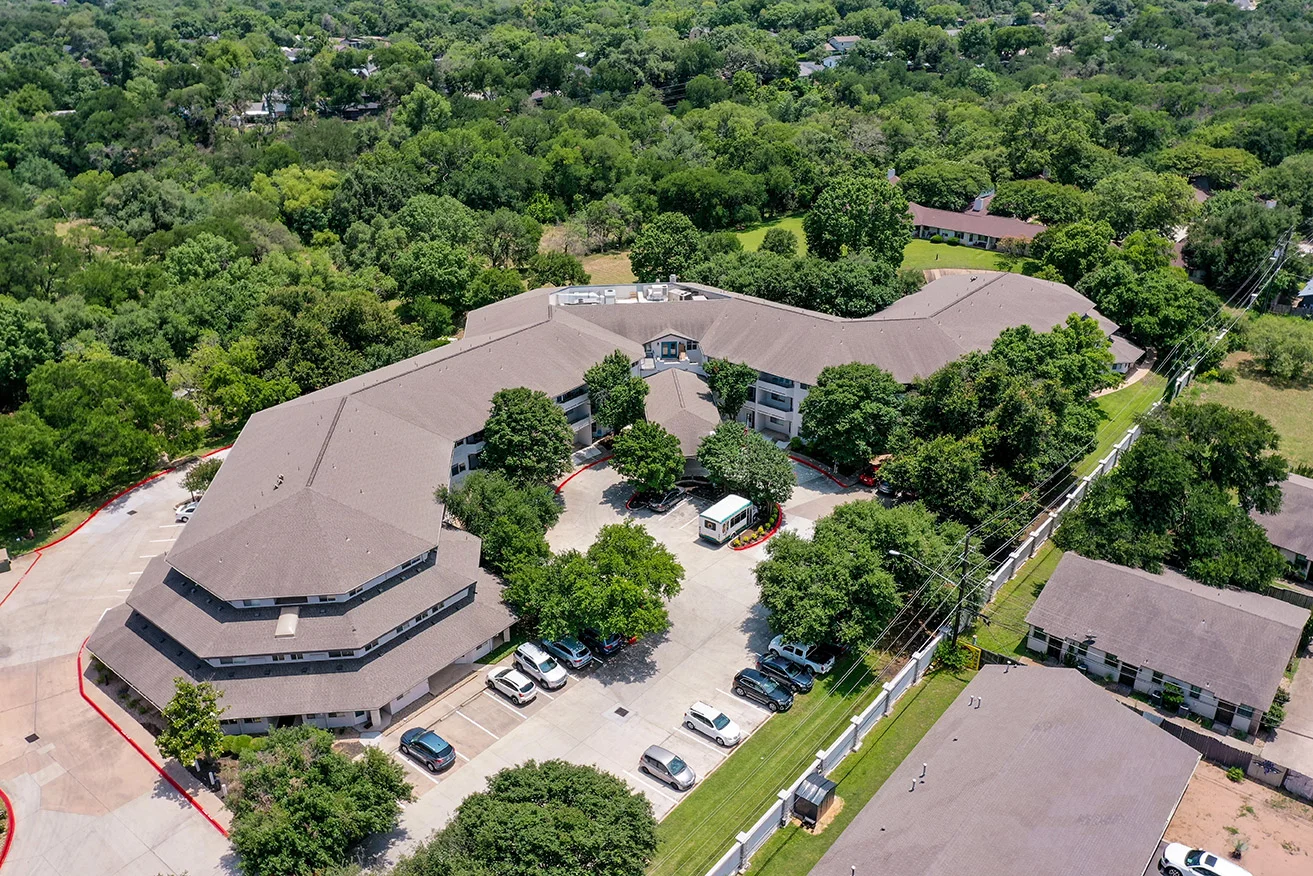 Aerial view of the Solstice Senior Living facility surrounded by trees