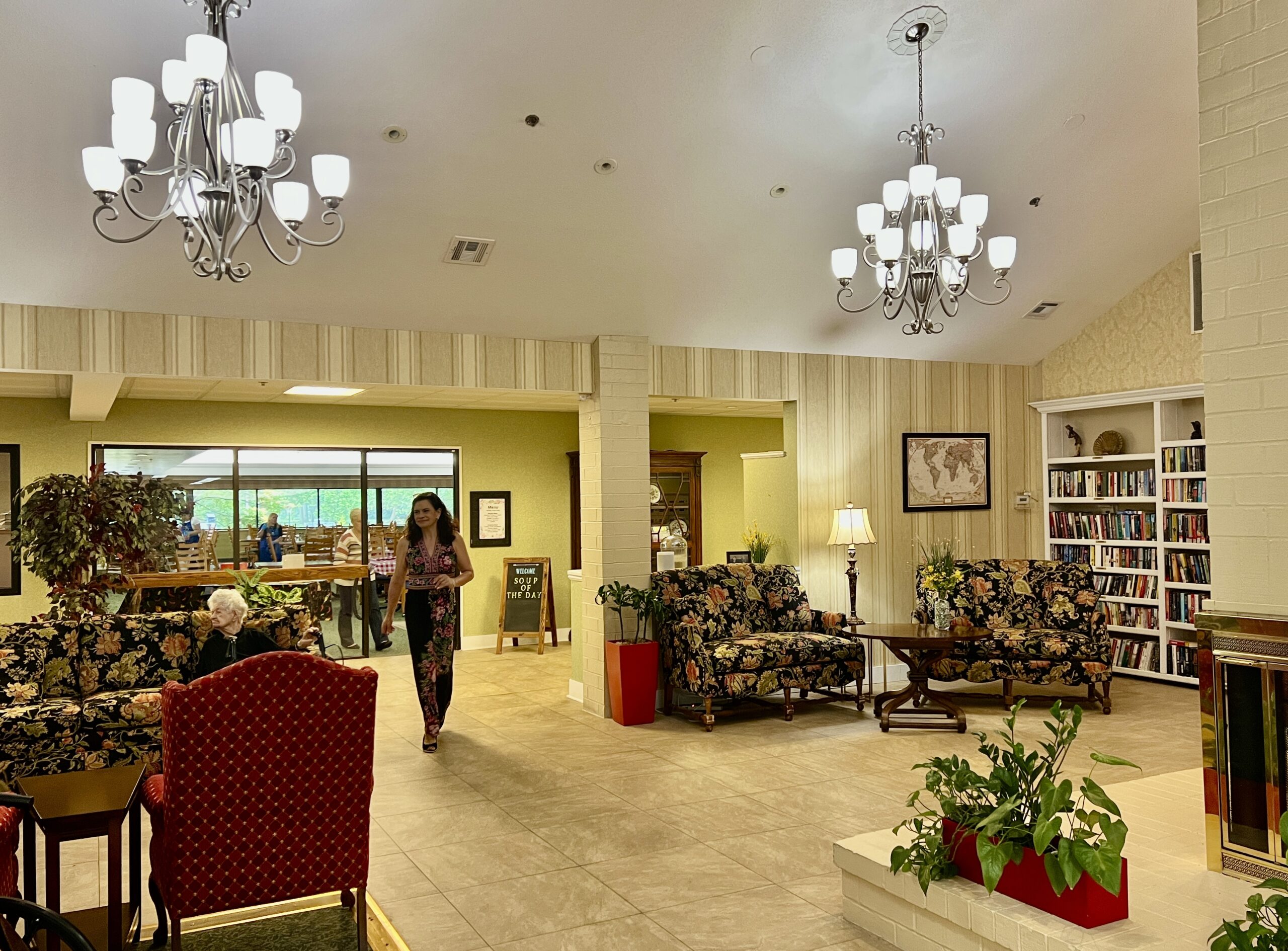 Interior of a common area with residents and furnishings