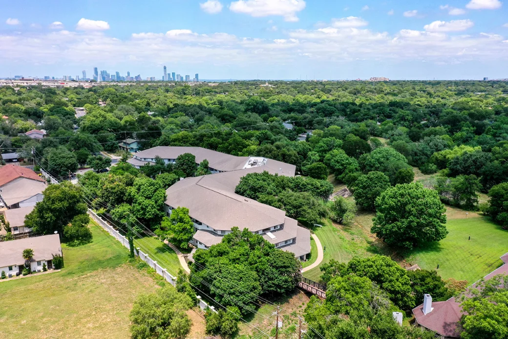 Aerial view of Solstice Senior Living at Austin surrounded by greenery