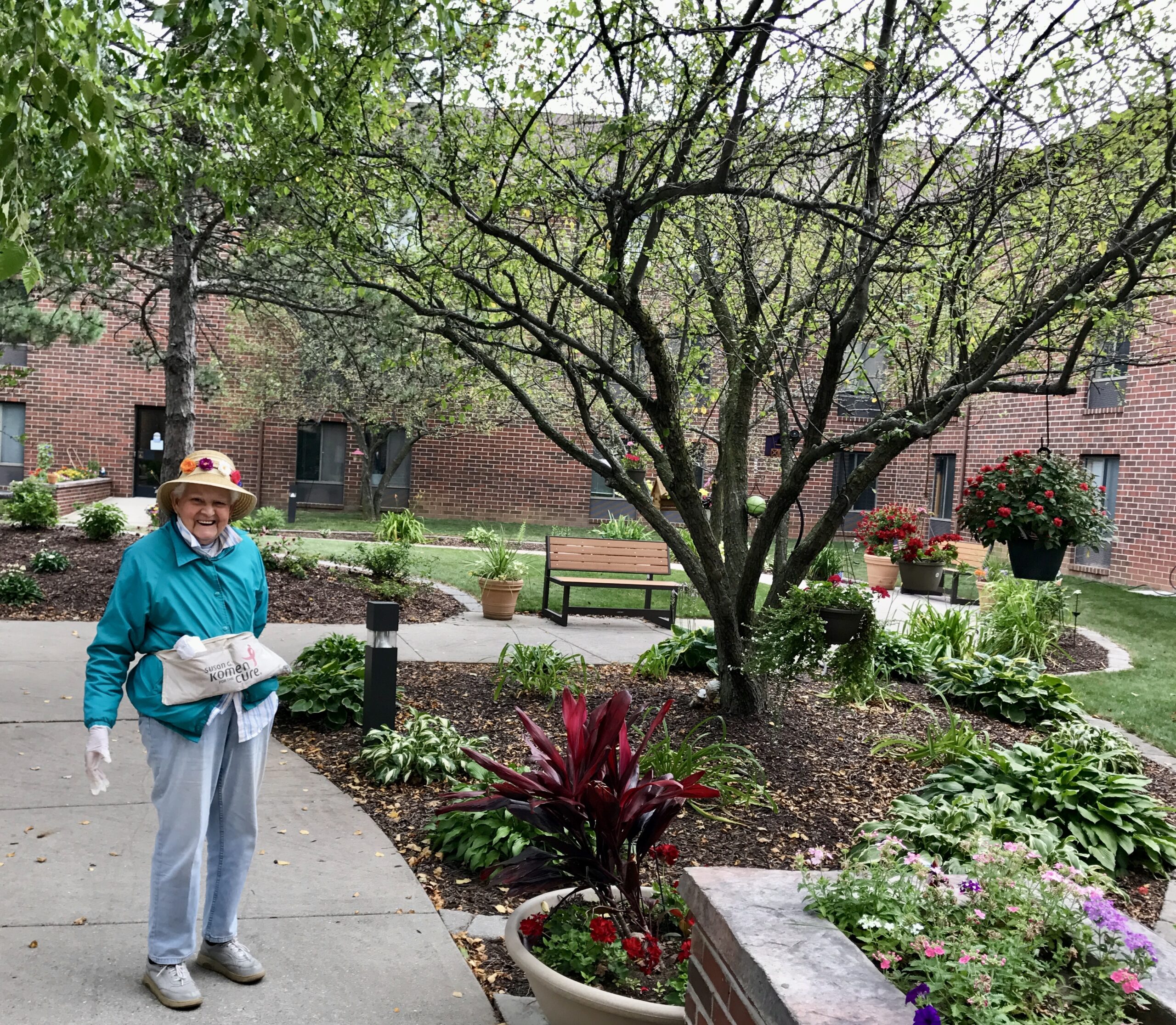 Resident enjoying greenery in the garden area