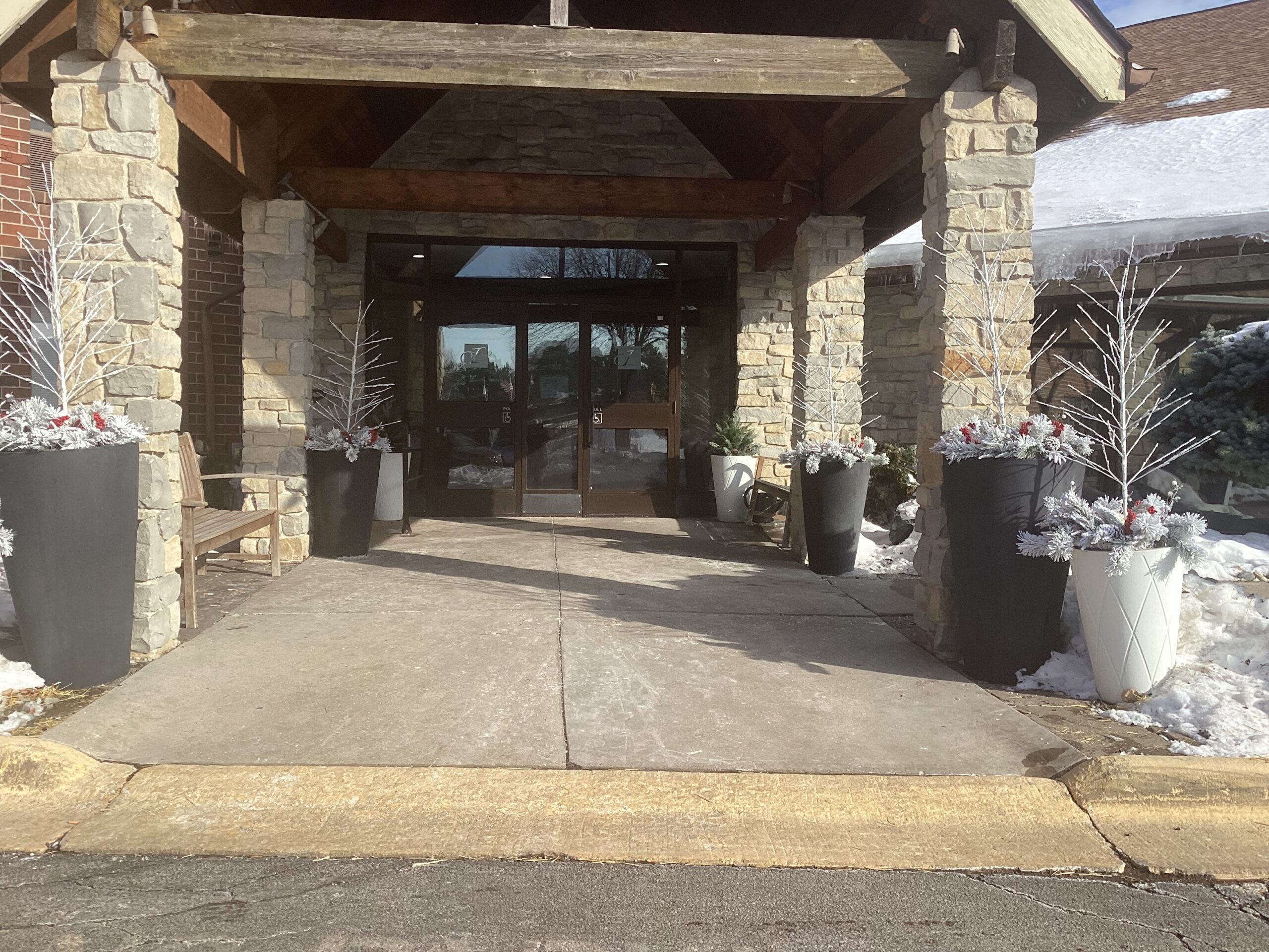 Entrance of a facility decorated for winter.