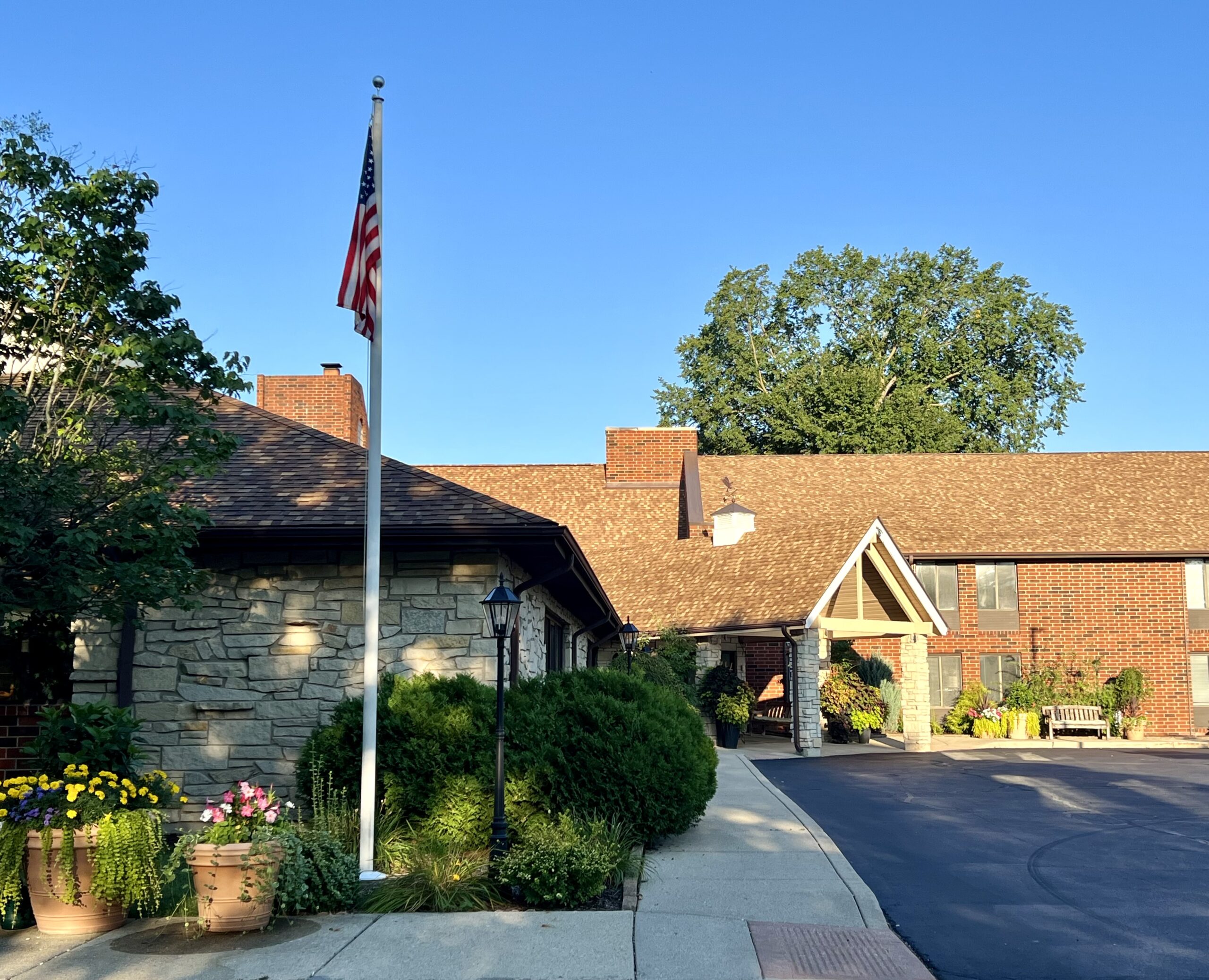 Exterior view of a senior living facility with landscaping