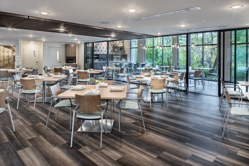 Bright dining room with tables set for meals