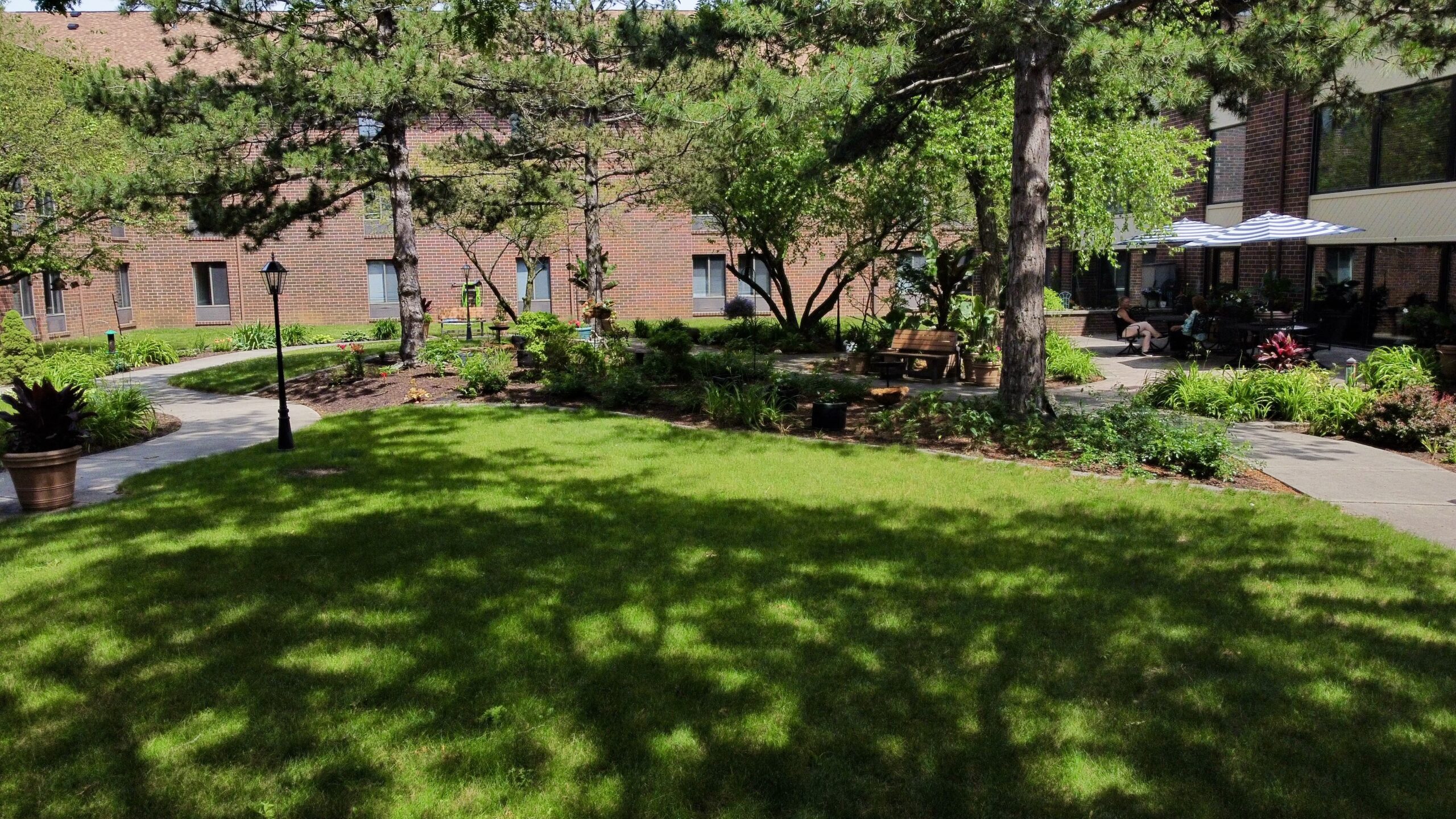 Outdoor space with benches and garden at the facility