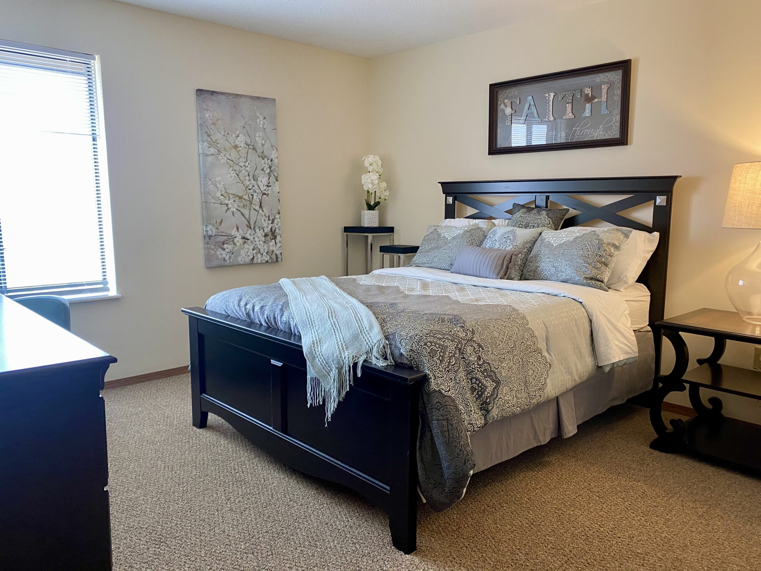 Cozy, well-decorated resident bedroom with furnishings
