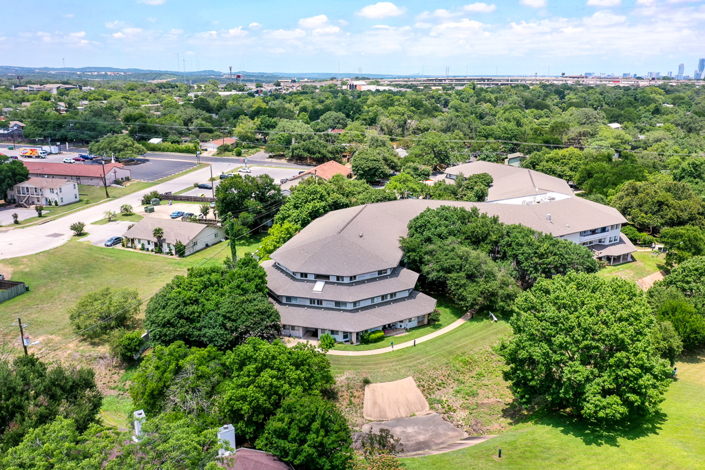 Aerial view of the senior living facility surrounded by greenery