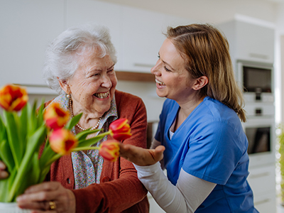 Staff member interacting joyfully with a resident