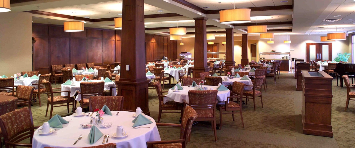 Dining room with tables set for a meal