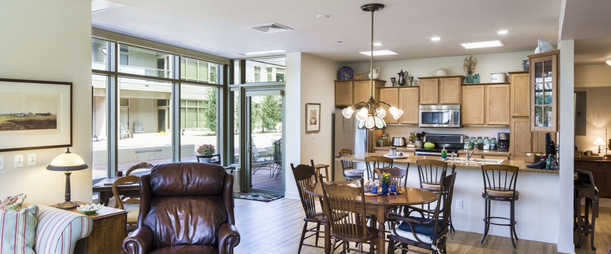 Bright common area with kitchen and dining space