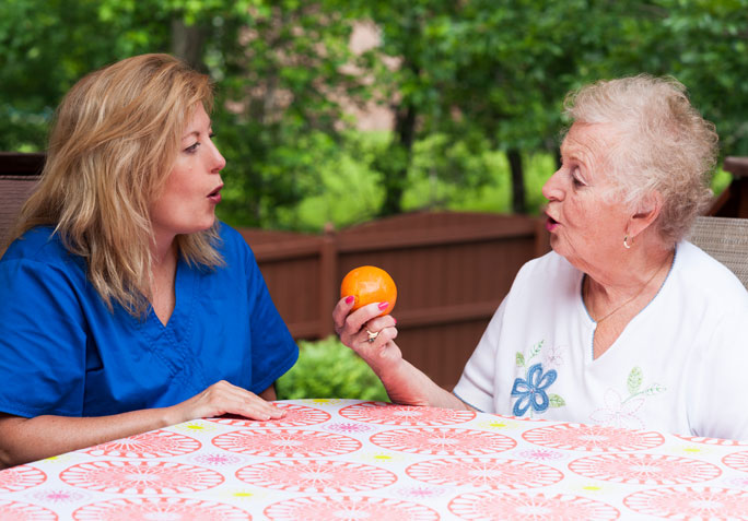 Staff member engaging with a resident outdoors