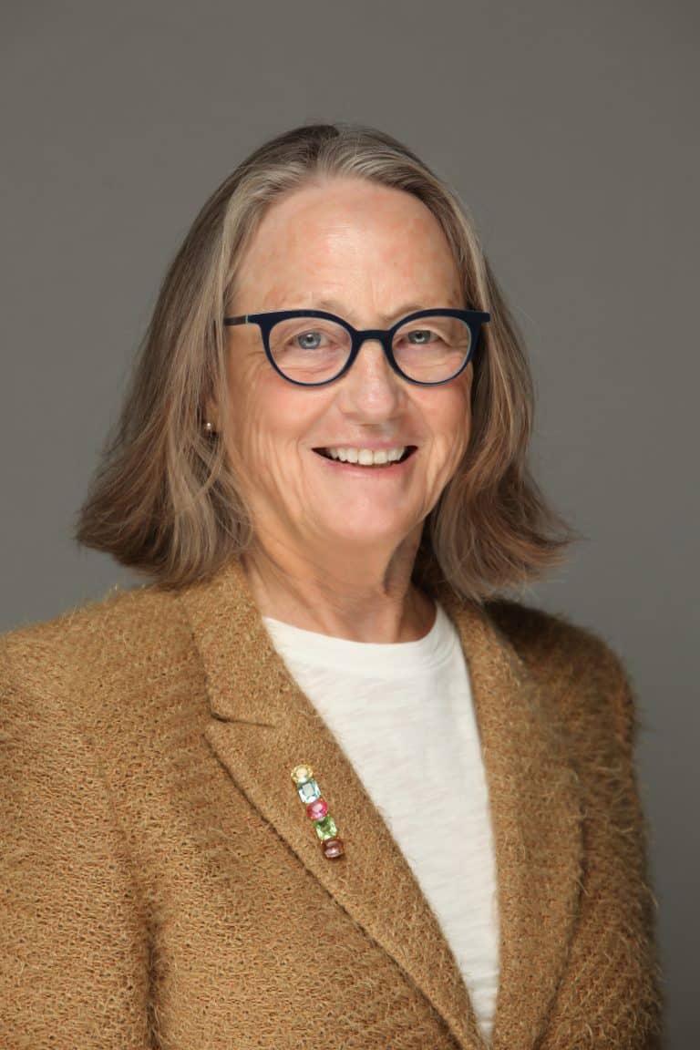 Portrait of a smiling woman in a blazer