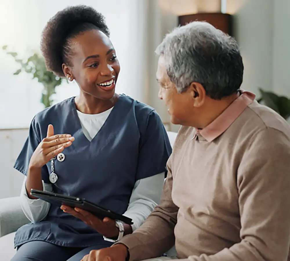 Staff member engaging with a resident in a common area