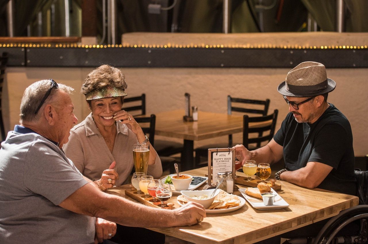Residents enjoying a meal and drinks together