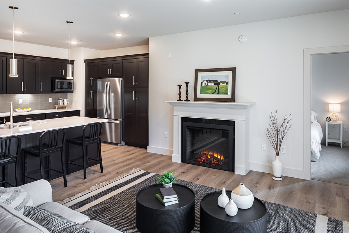 Modern interior living space with kitchen and fireplace