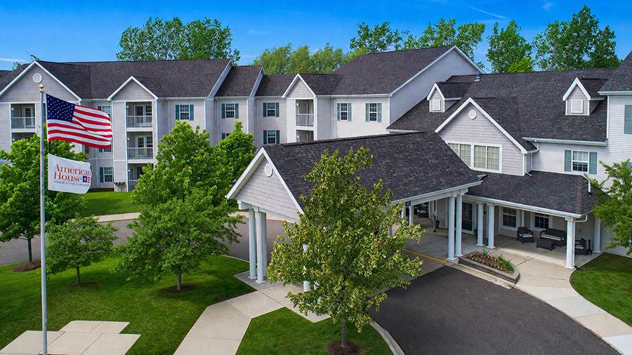 Exterior view of American House Troy with landscaping