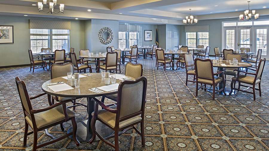 Bright dining room setup with tables and chairs