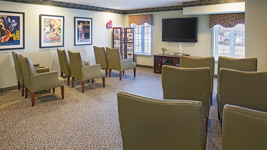 Common area with seating and decorative posters